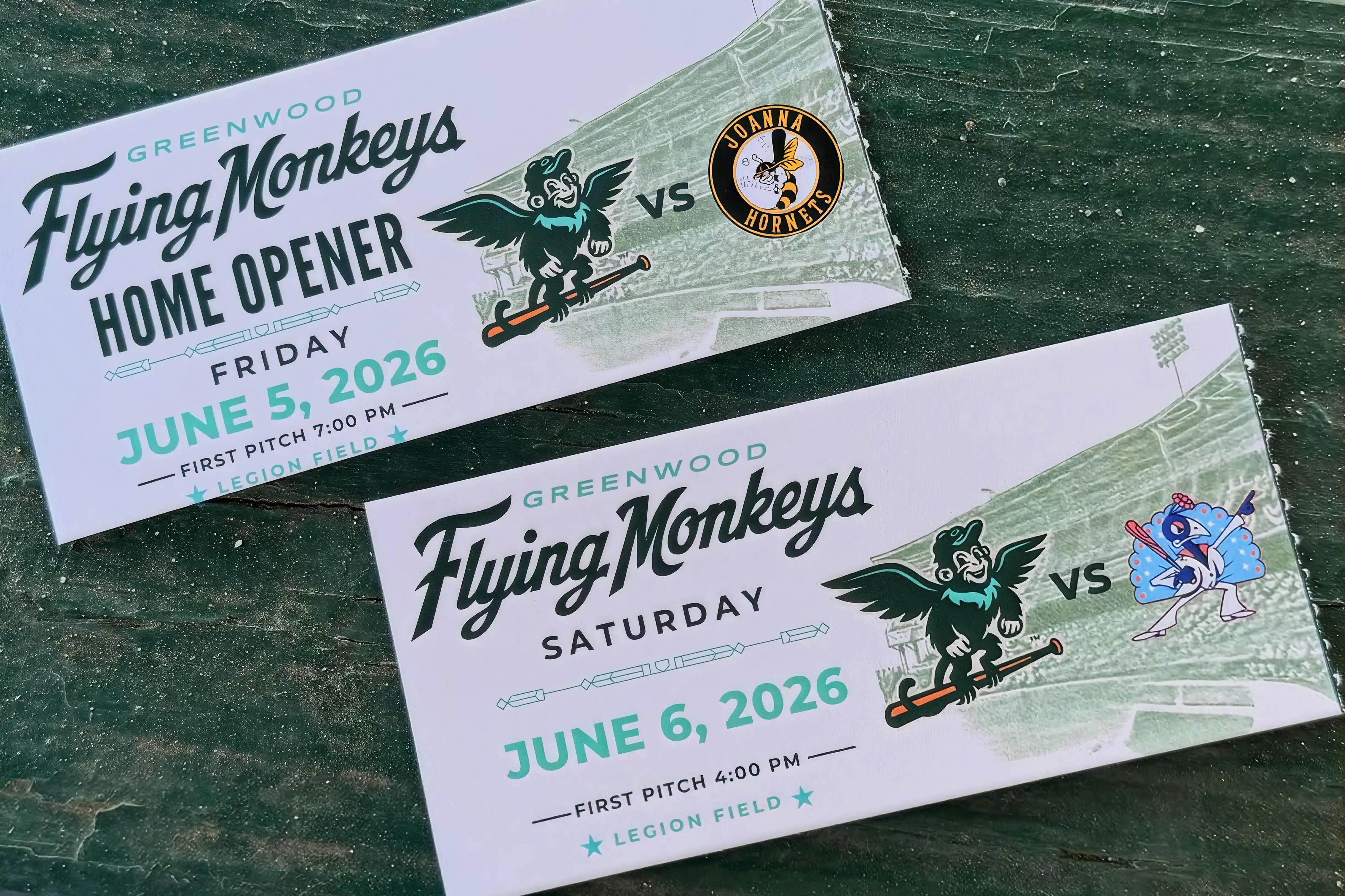Three Greenwood Flying Monkeys logos: one circular with letters GM and snowflake, another circular with a winged monkey wearing a cap, and a stylized G with wings in the center.