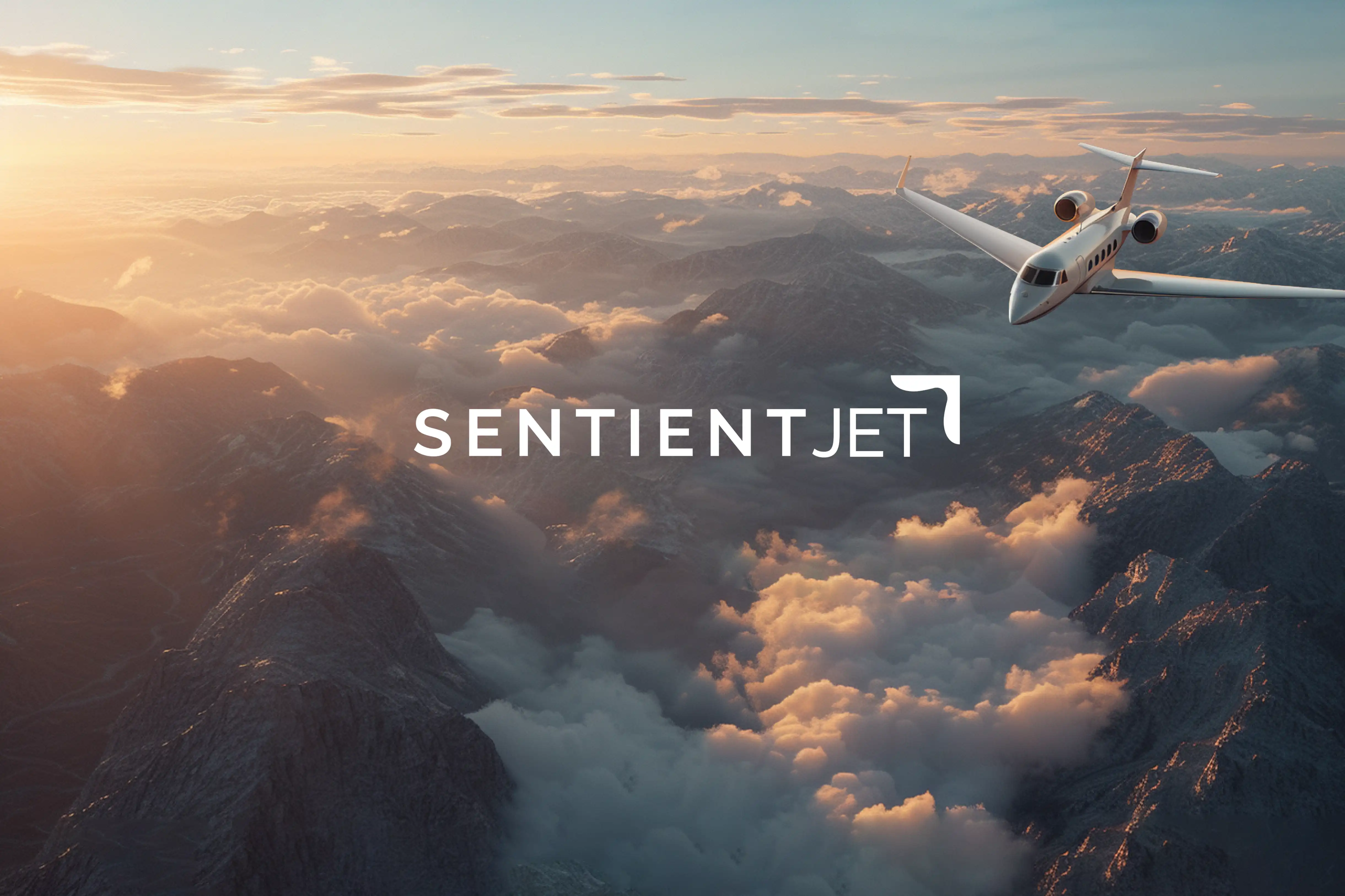 Private jet flying above mountain range and clouds during sunset with SentientJet logo overlay.