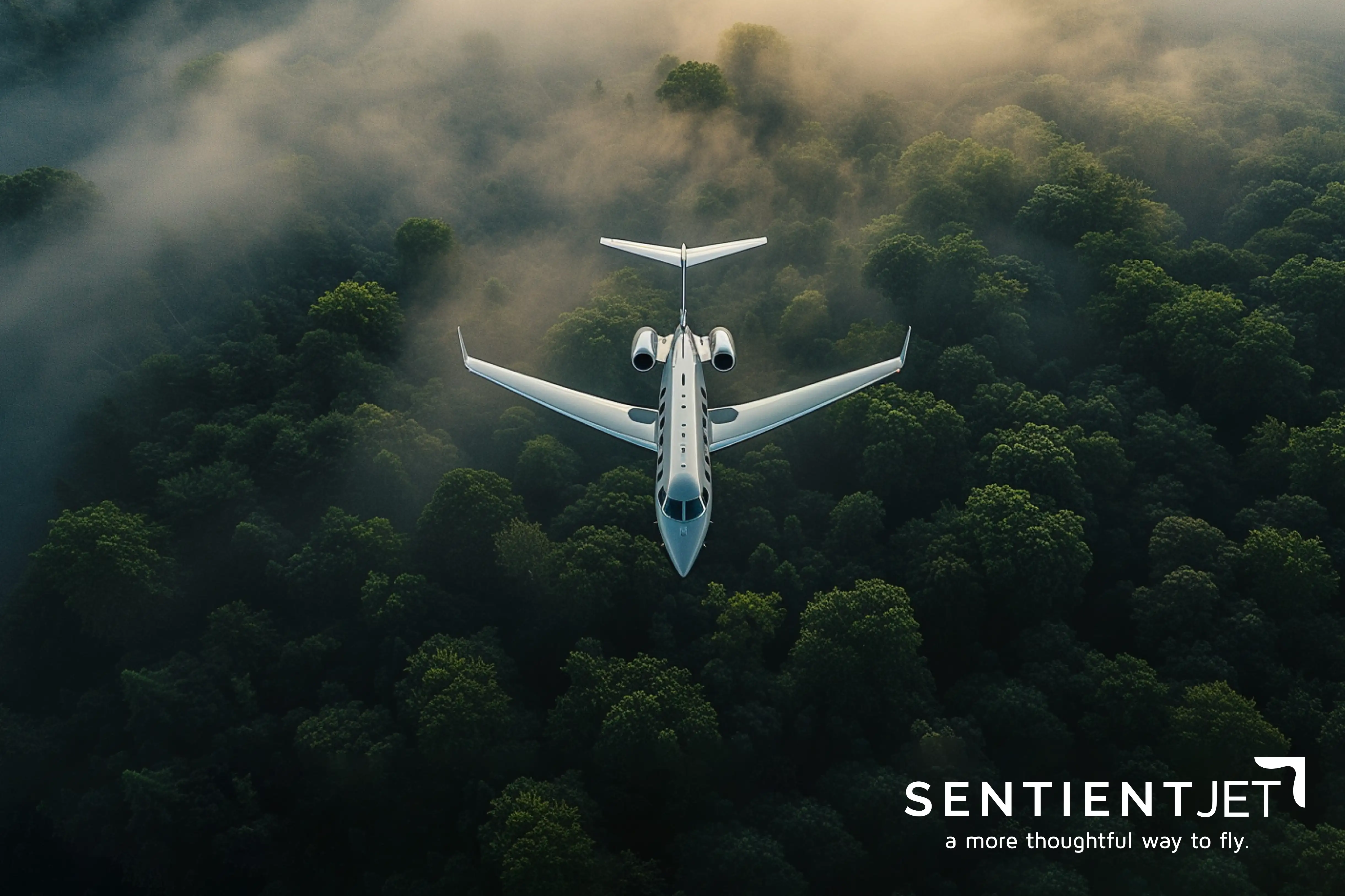 Private jet flying over foggy forest with Sentient Jet logo and slogan in the corner.