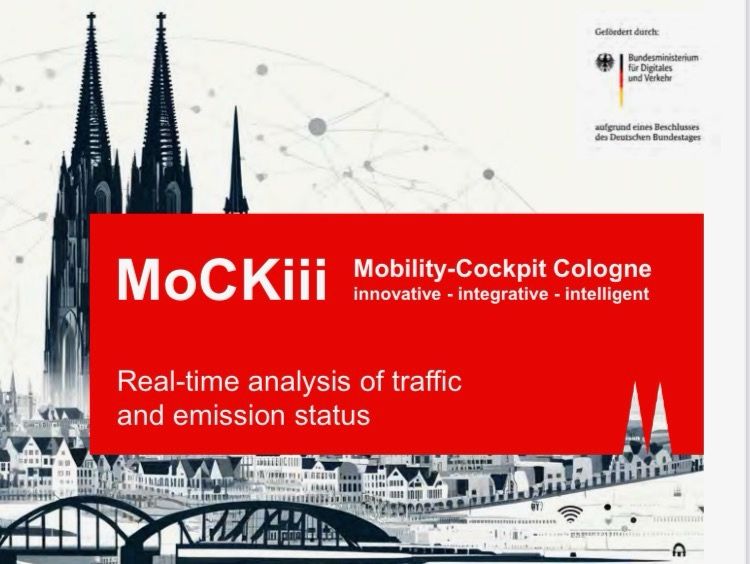 MoCKiii Flyerdesign der Stadt Köln, im Hintergrund in schwarz und weiß die kölner skyline mit Kölner Dom, im Vordergrund ein rotes Kästchen mit Schrift in weiß. Aufschrift: MoCKiii Mobility-Cockpit Cologne innovative-integrative-intelligent. Real-time analysis of traffic and emission status