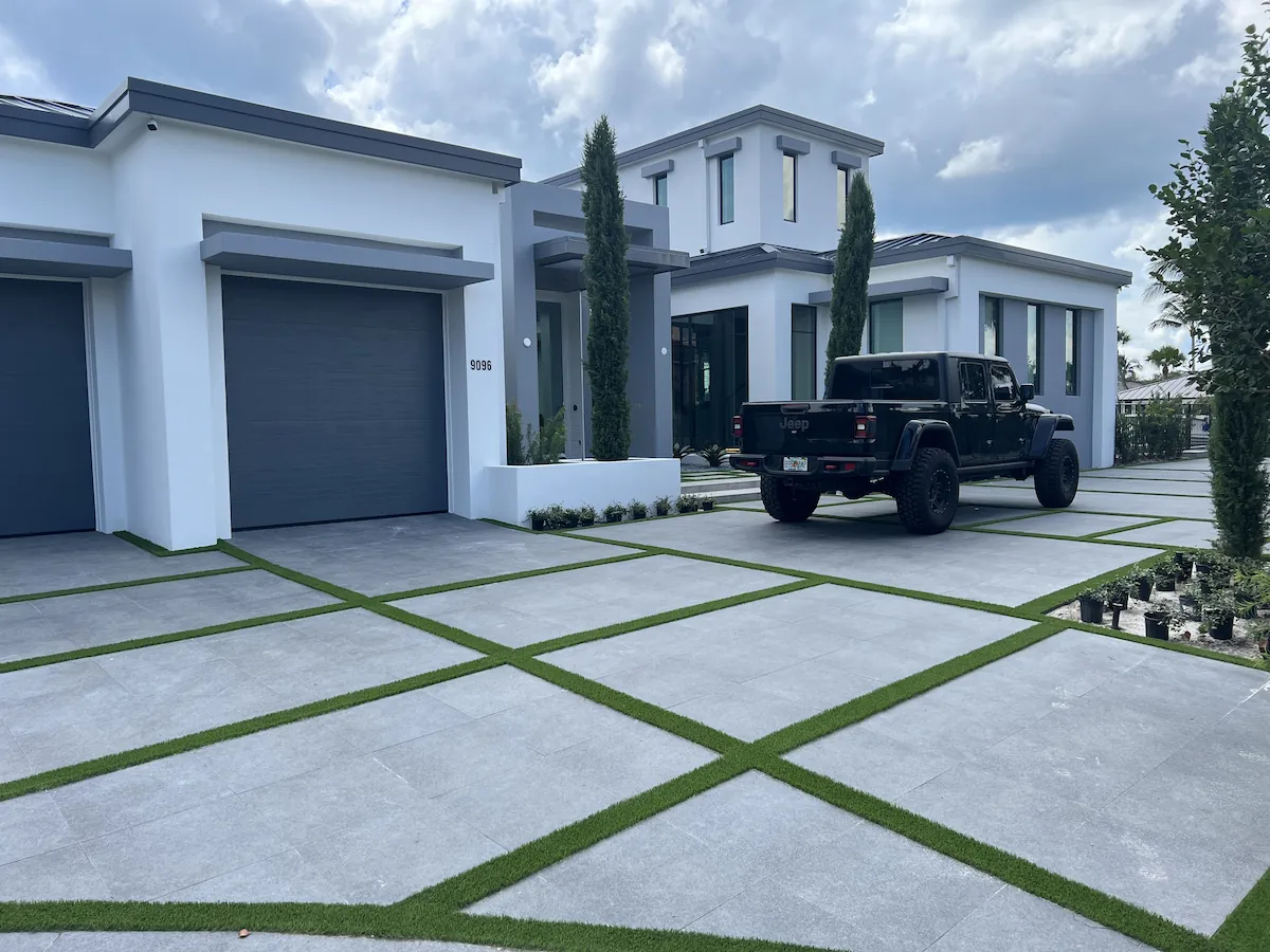 a black truck parked in front of a house