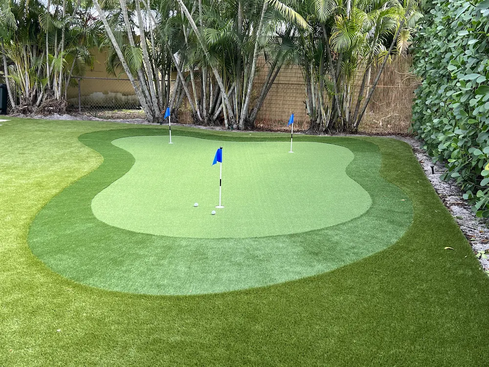 backyard putt course with blue flags