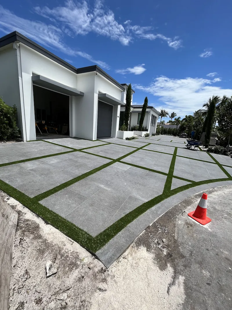 a house's driveway getting artificial turf installed