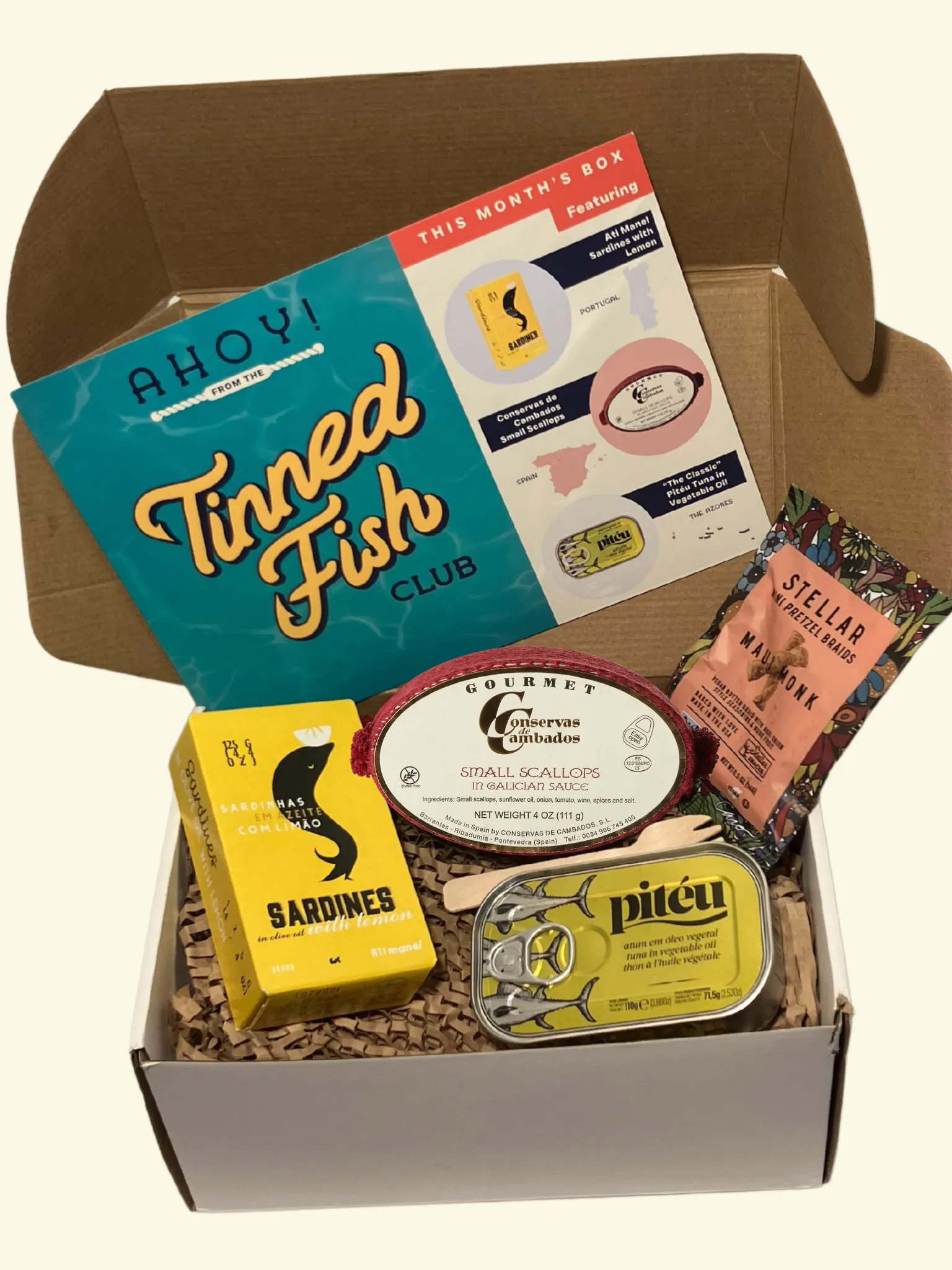 Tinned Fish Club March box with three premium tins and paired condiments