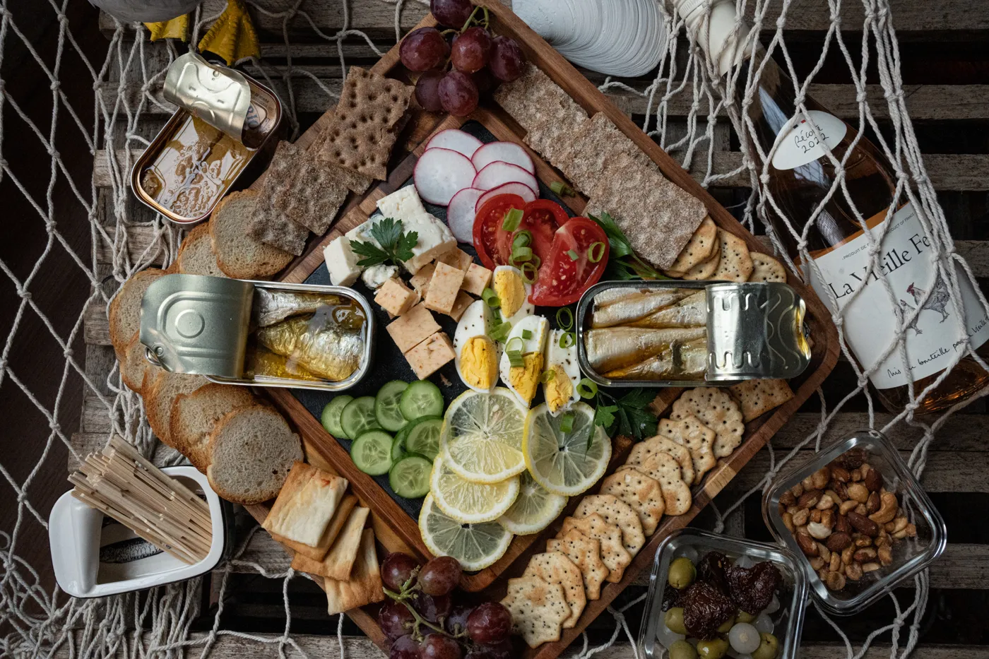 A spread of opened tins with food around them