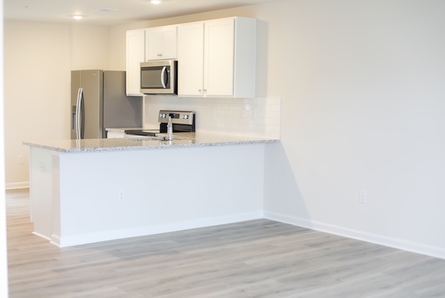 view of kitchen and dining area unfurnished