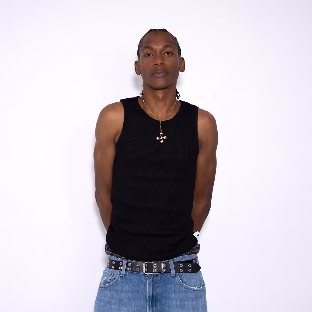 The Waffle Vest combines comfort and style with its waffle knit fabric and snug high collar. Crafted from a blend of cotton and spandex, this versatile tank offers a regular fit with an extended length, perfect for tucking in or creating a scrunch effect. Ideal for layering or wearing solo, it provides a sleek, modern look for everyday wear.