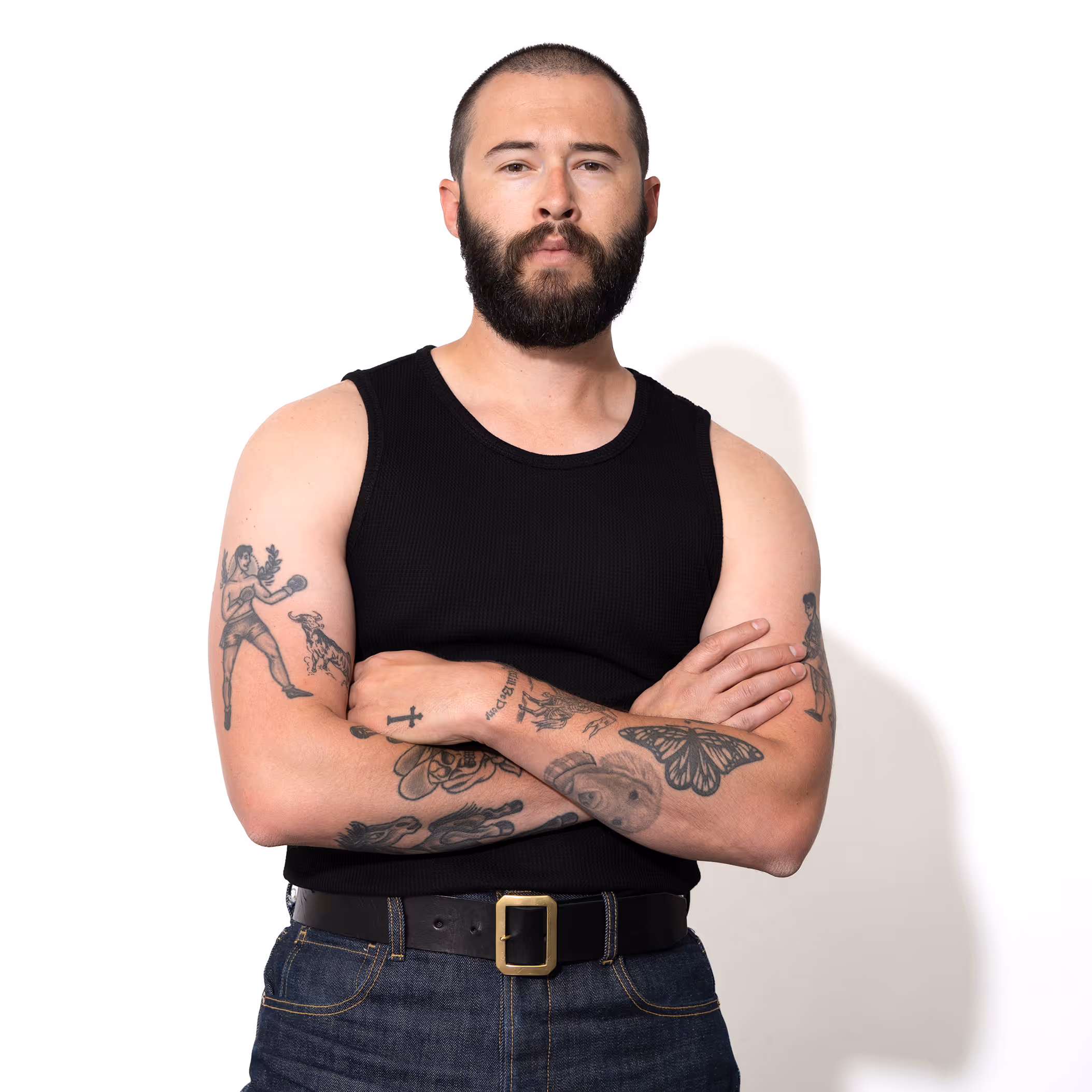 The Waffle Vest combines comfort and style with its waffle knit fabric and snug high collar. Crafted from a blend of cotton and spandex, this versatile tank offers a regular fit with an extended length, perfect for tucking in or creating a scrunch effect. Ideal for layering or wearing solo, it provides a sleek, modern look for everyday wear.