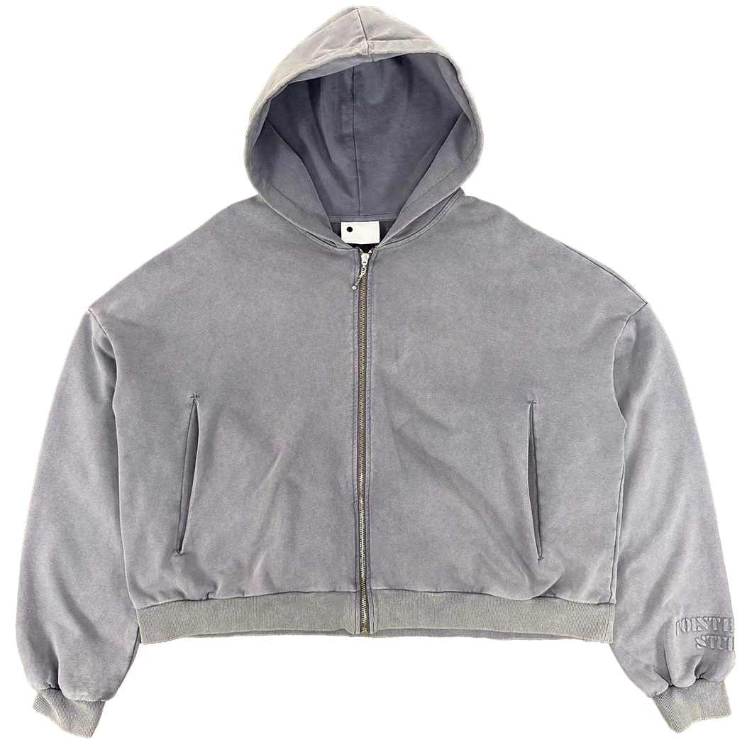 Quiet luxury. In washed Slate, this Heirloom Zip-Up is cut with a boxy, relaxed shape and finished with clouded stack sleeves for a draped, elevated feel. Made from 400 GSM cotton and detailed with a durable YKK zipper—effortless layering at its best.
