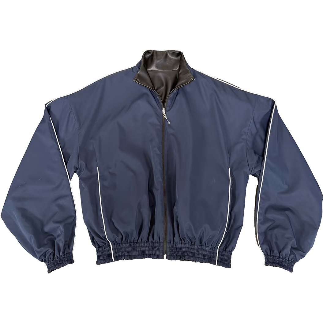 A REVERSIBLE OUTERWEAR JACKET CRAFTED WITH A SUPPLE VEGAN LEATHER EXTERIOR ON ONE SIDE AND A FULLY WATERPROOF NYLON SHELL ON THE OTHER. THE LEATHER FACE FEATURES DEEP HAND POCKETS WITH A HIDDEN SNAP BUTTON CLOSURE. WHILE THE REVERSE SIDE OFFERS ZIP-SECURED POCKETS WITH DURABLE YKK HARDWARE, 3M REFLECTIVE PIPING AND A 3M BACK STITCHED LOGO. RELAXED SILHOUETTE WITH A HIGH COLLAR NECK & TAPERED HEM. ALL ORDERS SHIP IN 2-3 BUSINESS DAYS FROM OUR WAREHOUSE IN UTAH.
