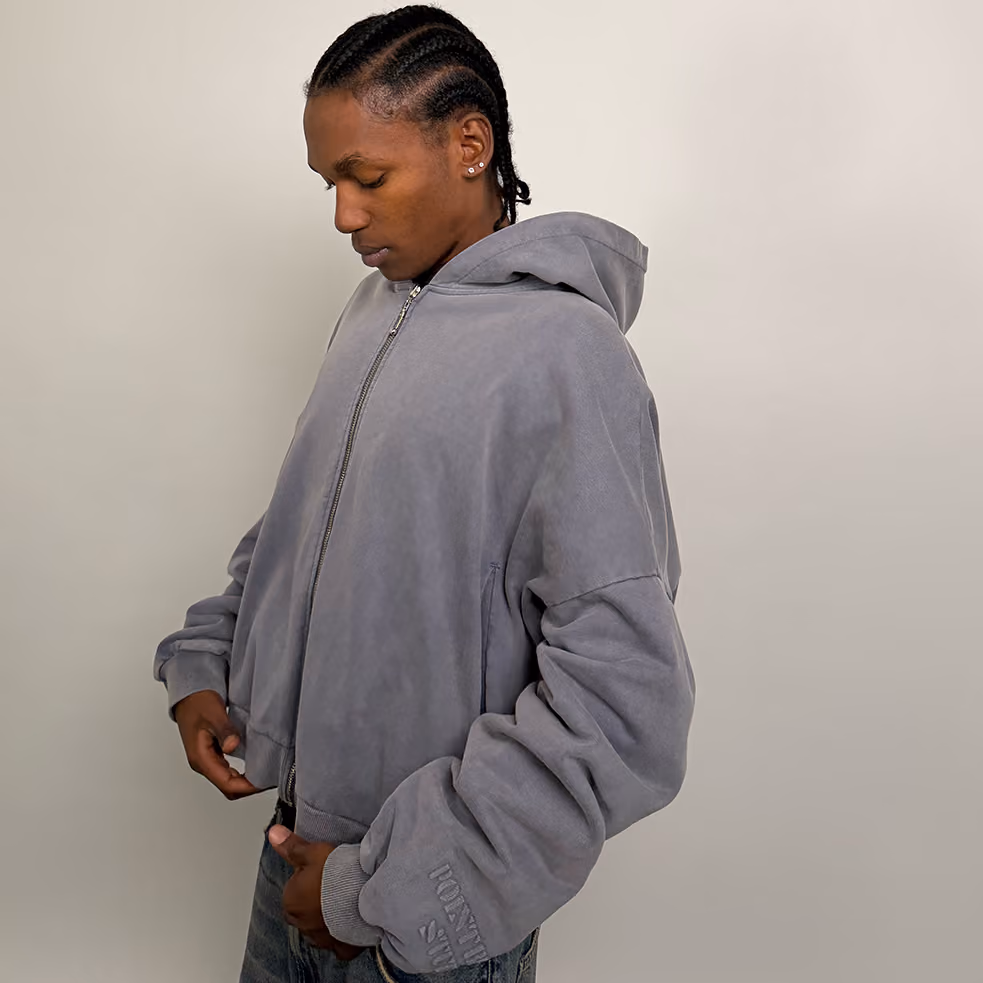 Quiet luxury. In washed Slate, this Heirloom Zip-Up is cut with a boxy, relaxed shape and finished with clouded stack sleeves for a draped, elevated feel. Made from 400 GSM cotton and detailed with a durable YKK zipper—effortless layering at its best.