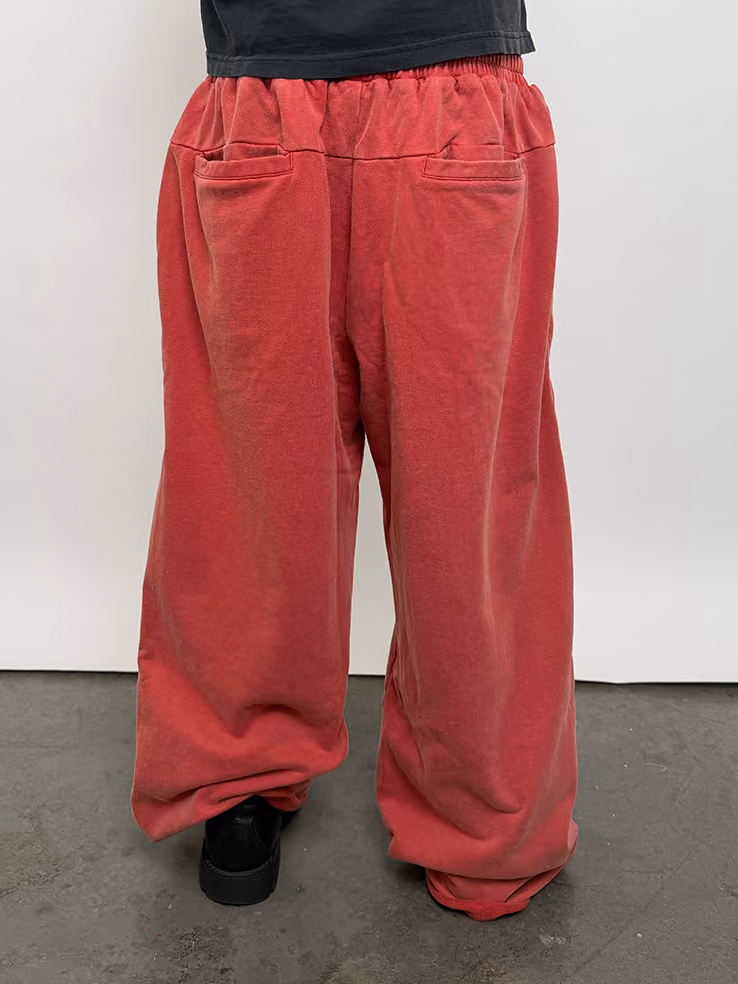 Bold and broken-in. The Cherry Heirloom Sweats bring a deep, mineral-washed red to a wide-leg, baggy silhouette. Made from heavyweight cotton, they’re built for lounging in comfort or stepping out in a statement fit.