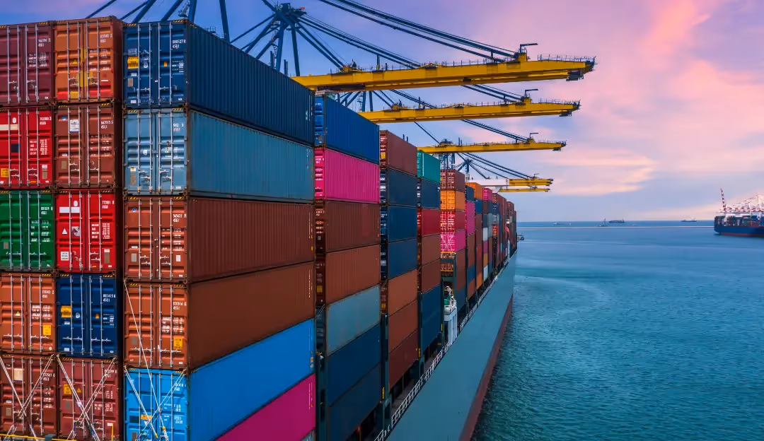  Interior view of an aircraft maintenance hangar with two white commercial airplanes. One jet engine is exposed, and maintenance platforms and equipment surround the aircraft under a high ceiling with metal beams.