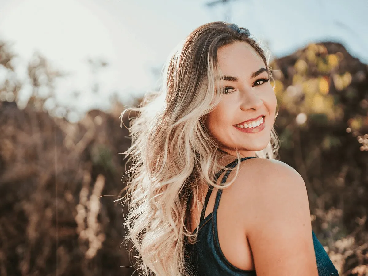 Confident woman in her 50s enjoying an active lifestyle after bioidentical hormone replacement therapy at Hagen Health.