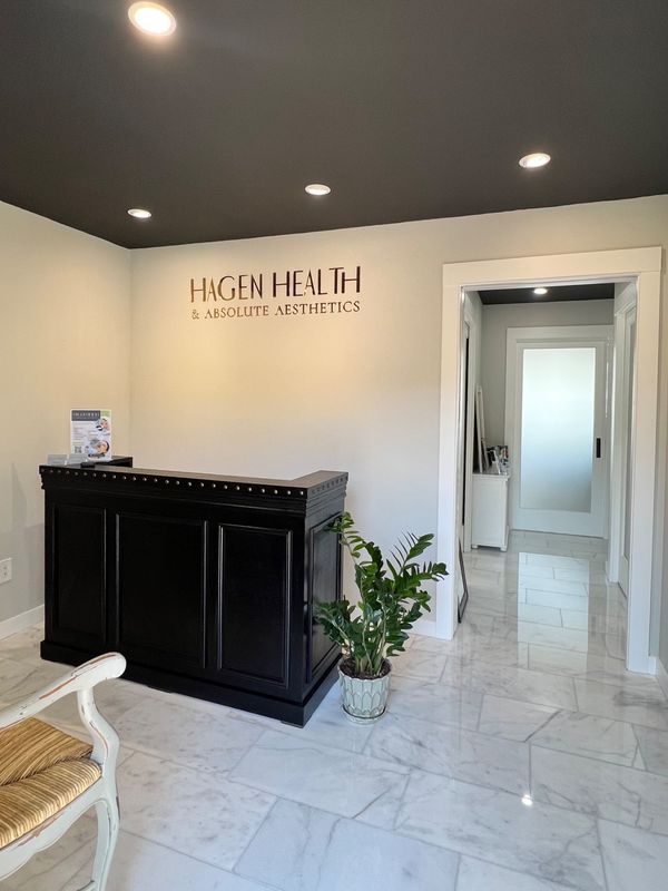 Reception area at Hagen Health & Absolute Aesthetics in Mukilteo near Everett, Lynnwood, and Mill Creek. Modern medical spa and clinic offering hormone replacement therapy (HRT), aesthetic skin care, laser hair removal, electrolysis, cosmetic injectables, microneedling, acne and rosacea treatments, hyperpigmentation care, scar and stretch mark reduction, tattoo removal, wrinkle and texture improvement, menopause support, and low testosterone treatment