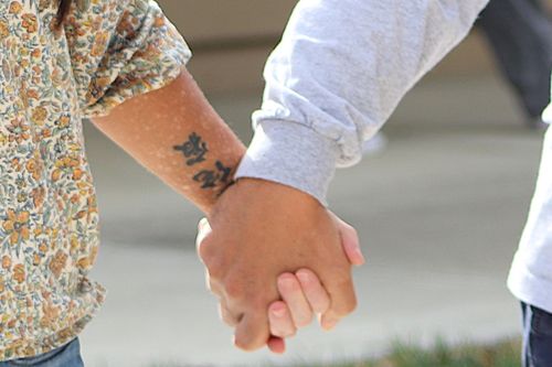 A man writing for marriage counseling class