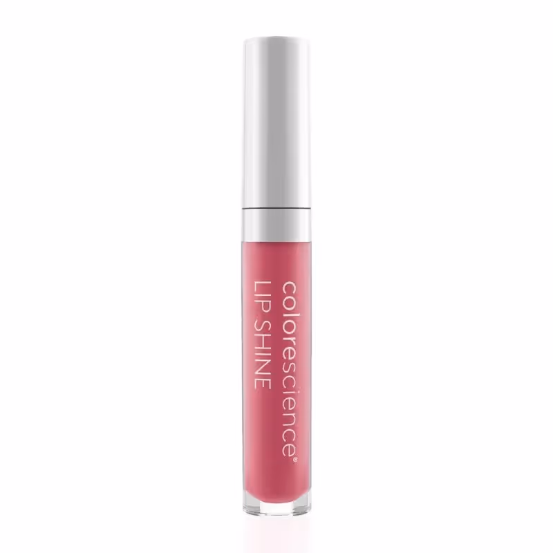 En tube Colorescience Lip Shine med SPF 35 i rosa. Lipglossbeholderen er sylindrisk med en hvit hette. Merkenavnet og produkttypen er skrevet vertikalt på tuben