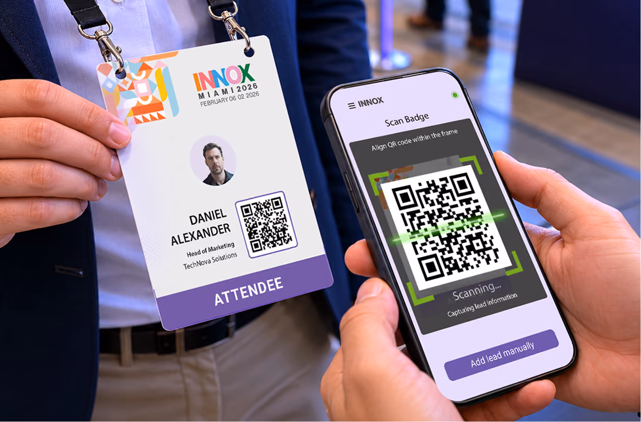 Person scanning a conference badge QR code with a smartphone app for lead capture.