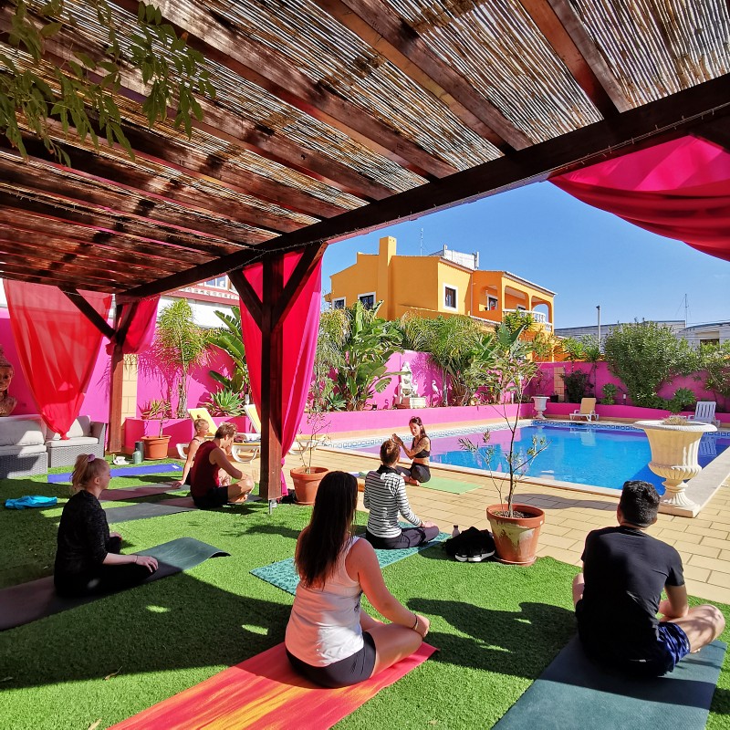 A photo of our conscious Community practicing Yoga