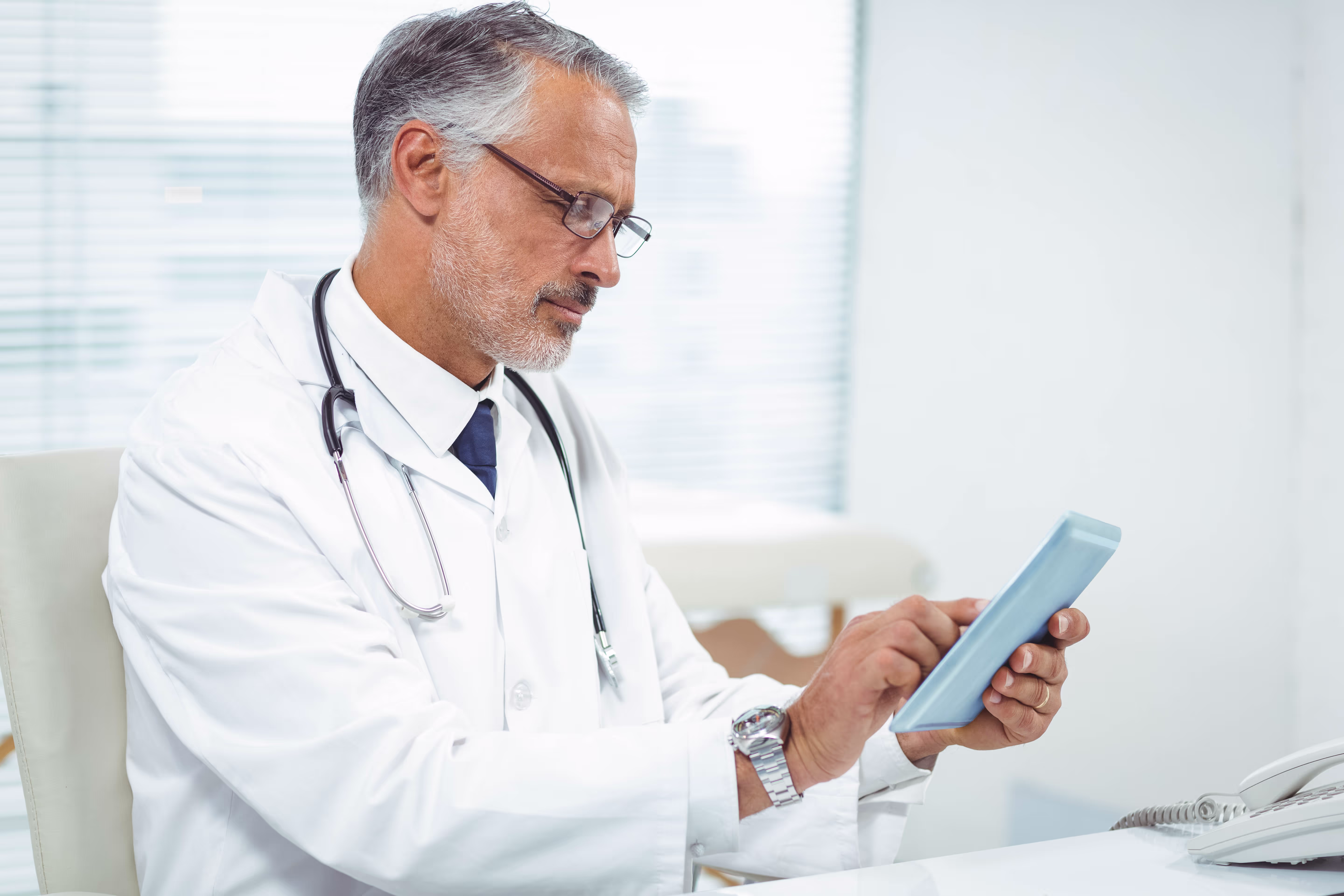 Doctor looking inpool app in his ipad