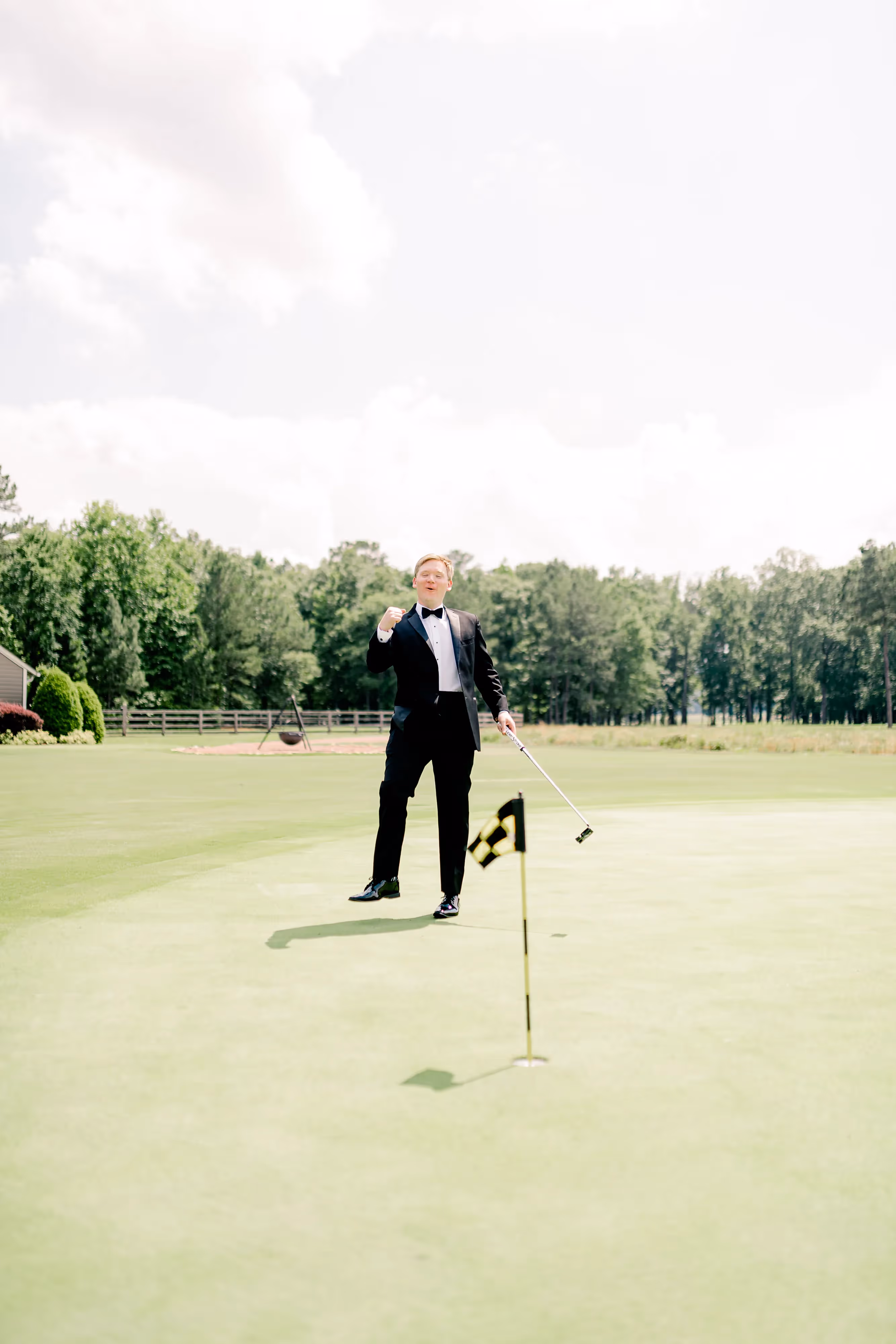 Groom spends pre-ceremony time on the putting green.