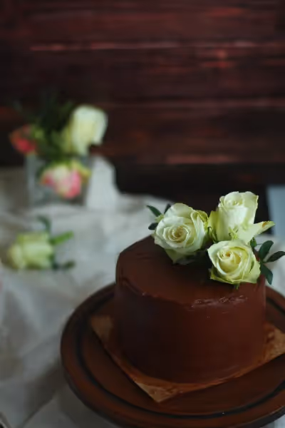 Chocolate ganache wedding cake with rose topper.