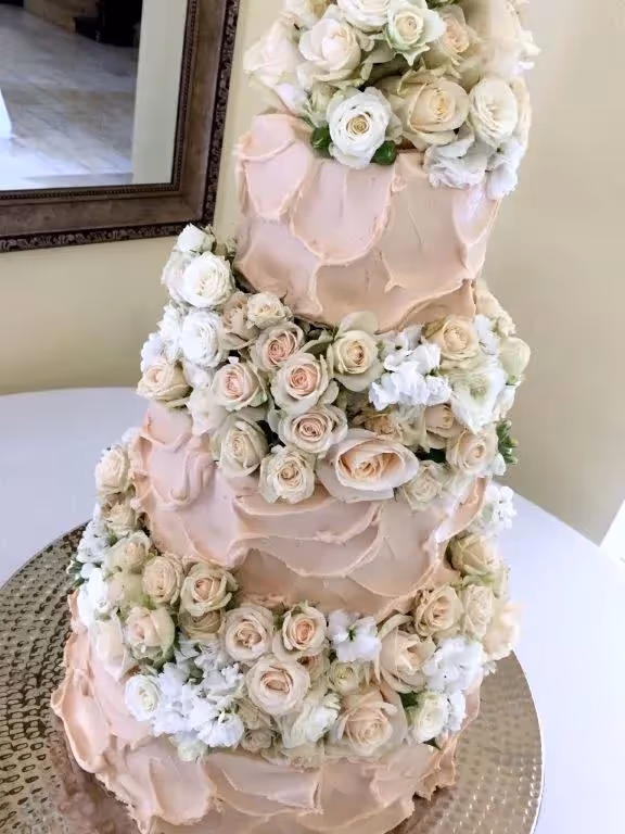 Wedding cake with custom florals by Olexa's.