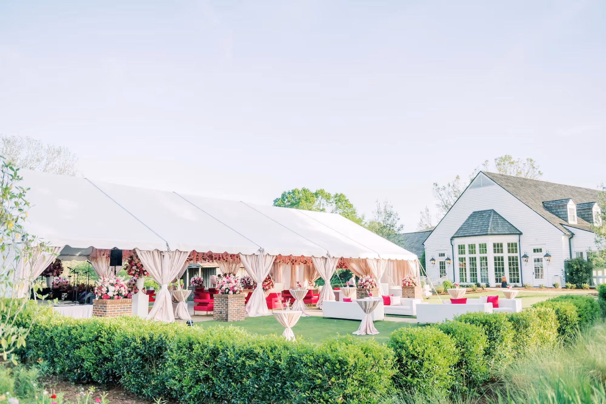 Wedding venue with event tent for reception along with multiple other staging locations on property.