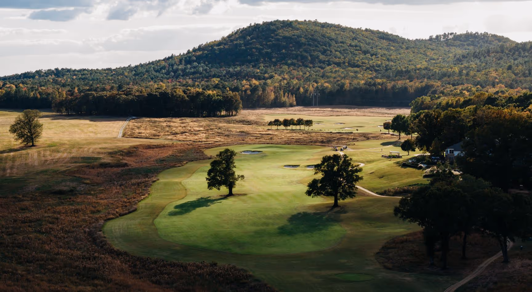Aerial view of The Inn, cottages & cabins, and FarmLinks Hole #18.