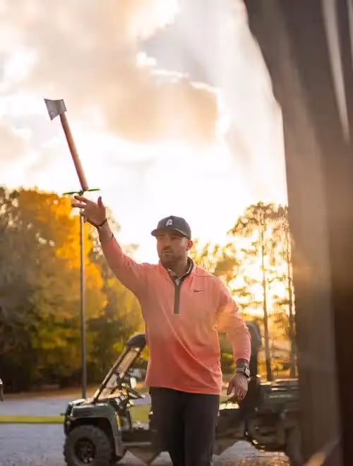 a man throwing an ax