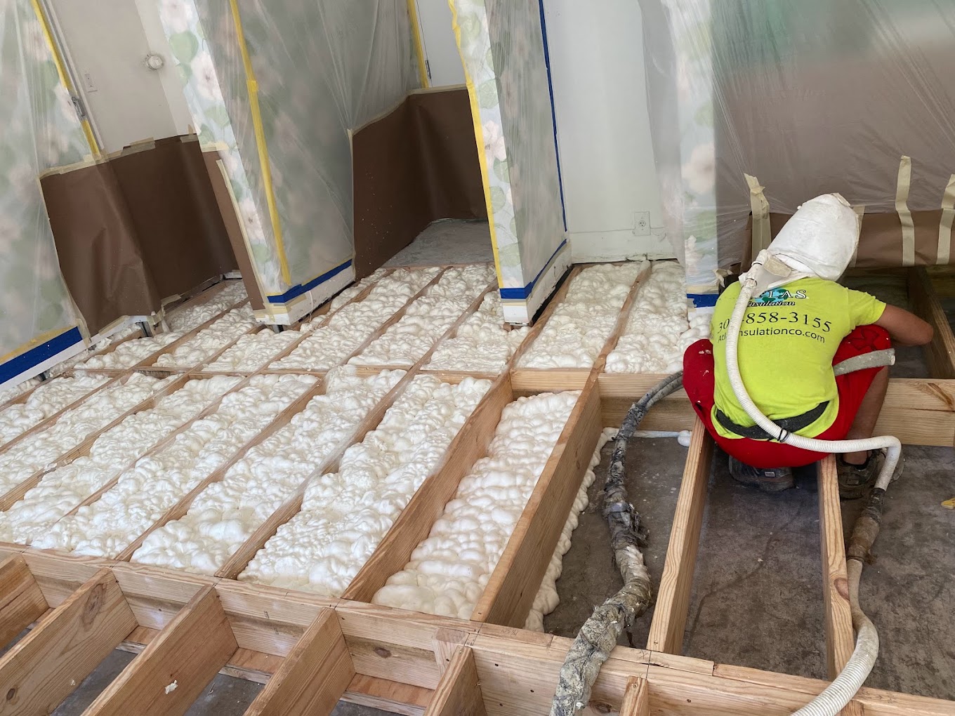 Attic insulation coverage depth gauge showing proper blown-in insulation depth in a Florida home