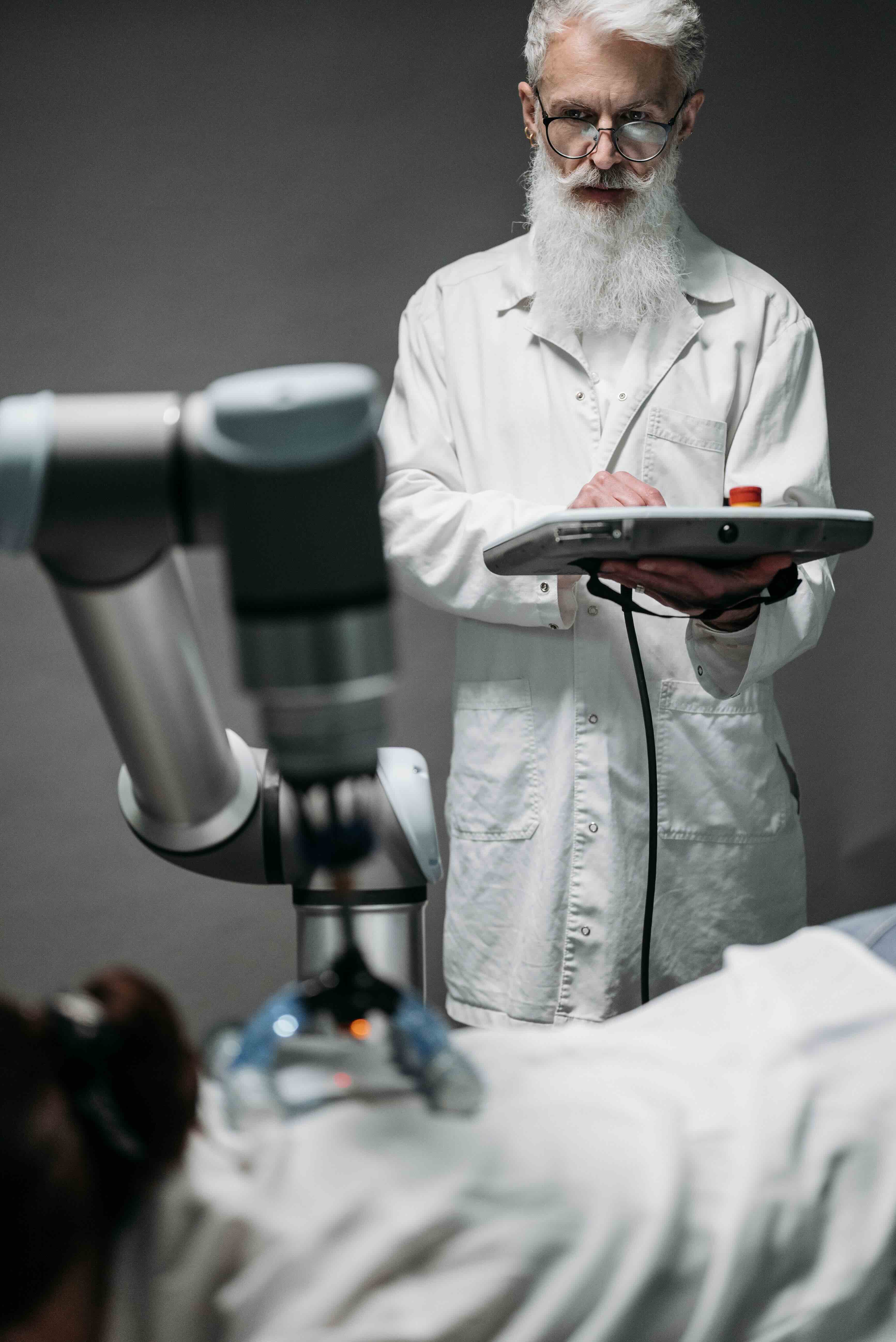 Clinician working with advanced medical robotics technology