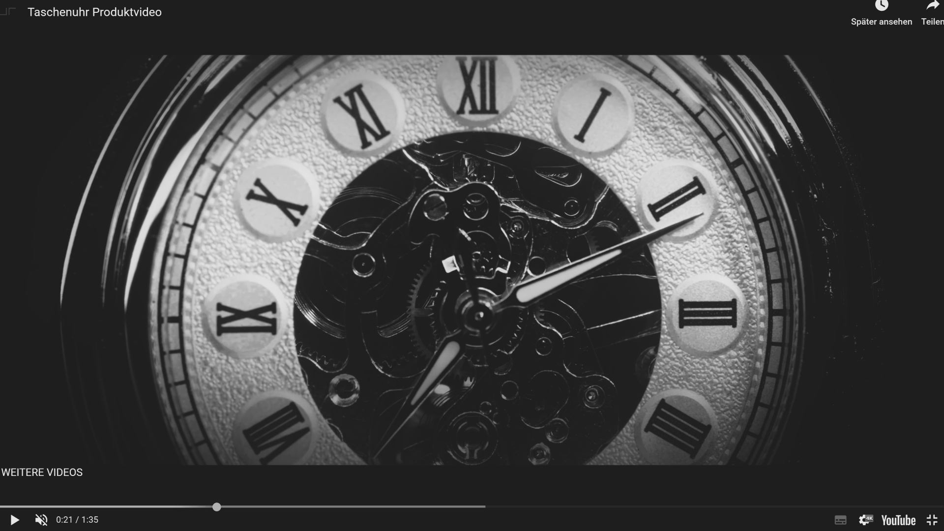 Close-up of a mechanical pocket watch dial with Roman numerals and visible internal gears, displaying the time at approximately 7:11.