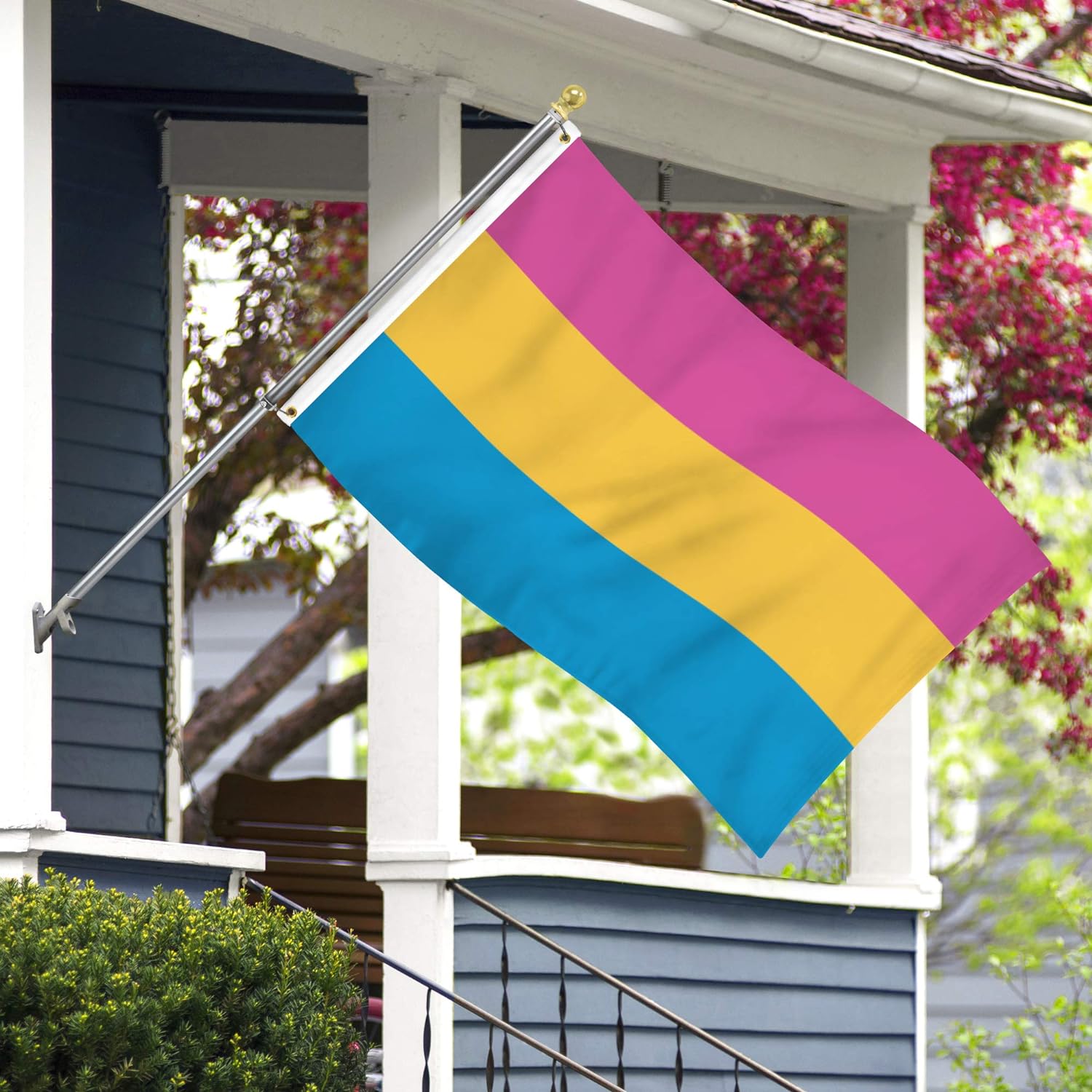 pansexual pride flag flying in front of a house
