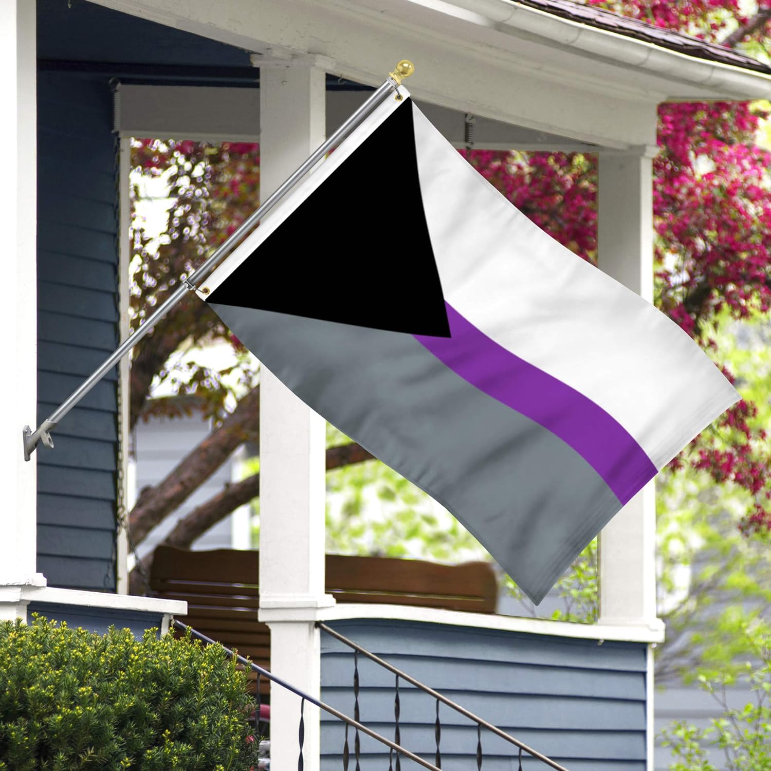 demisexual pride flag flying in front of a blue house
