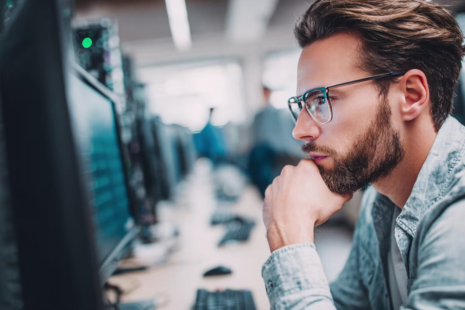 IT Professional Analyzing Risk Management Data