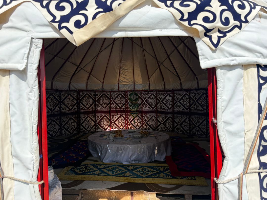 Table set inside a decorated yurt