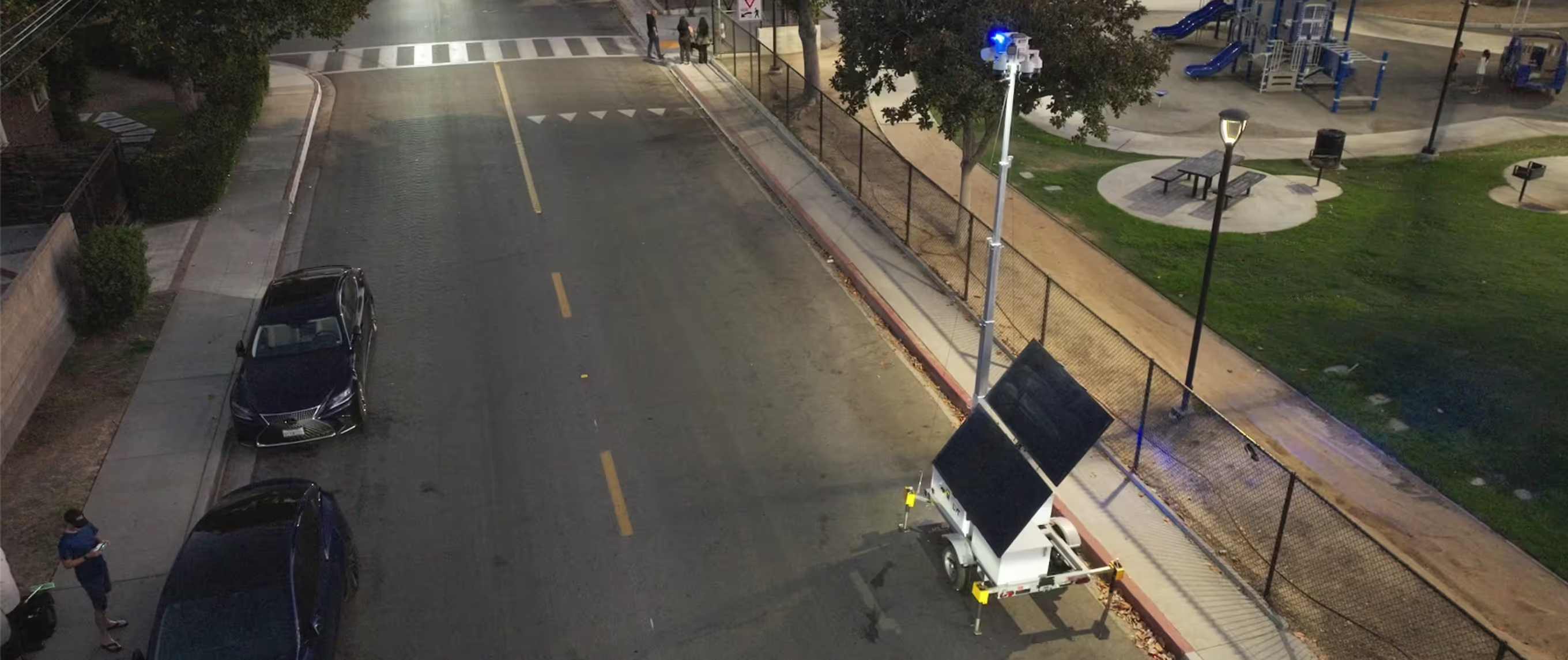 Integr8 trailer deployed on a street at dusk, monitoring vehicles and pedestrians