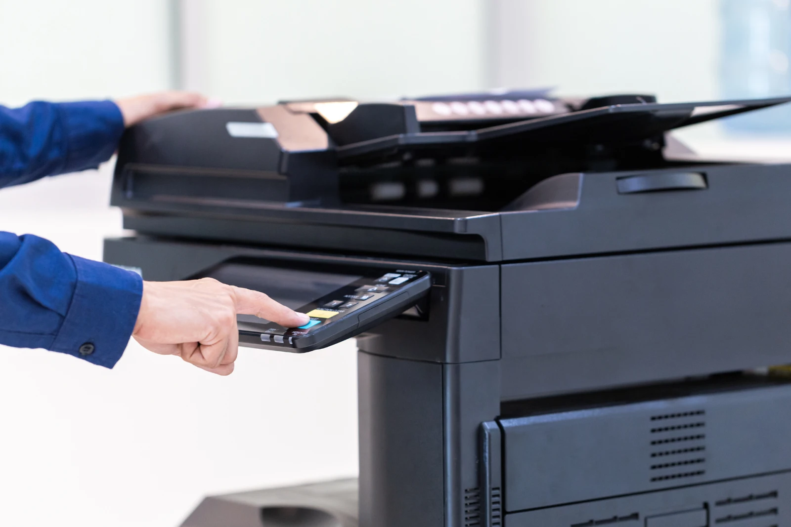 An employee using a printer