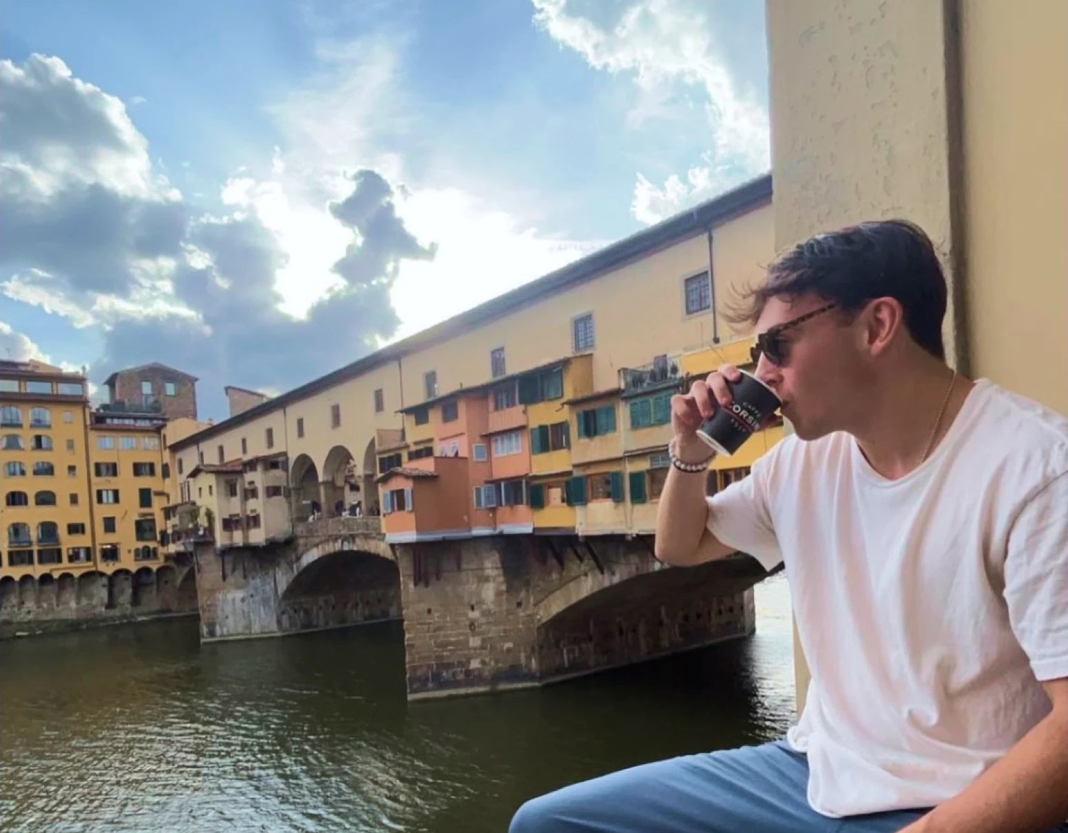 Brendan drinking coffee in Florence during his study abroad