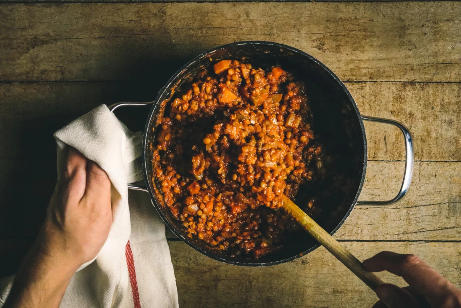 A man cooking lentils for New Year's Eve dinner