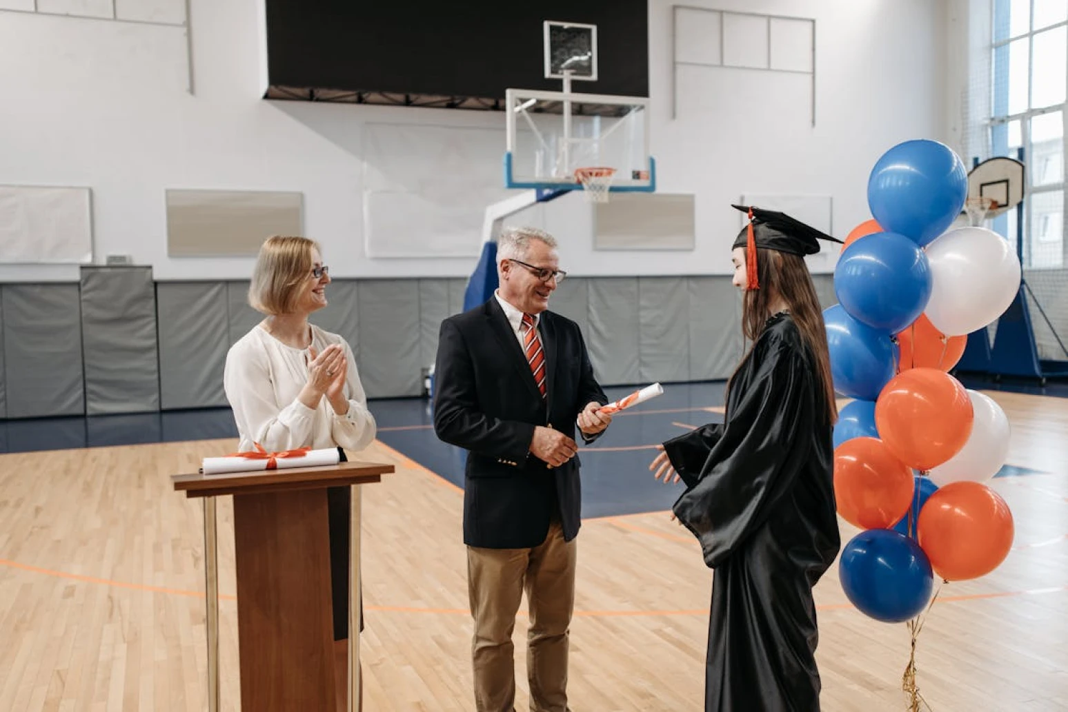 Girl getting her US high school diploma