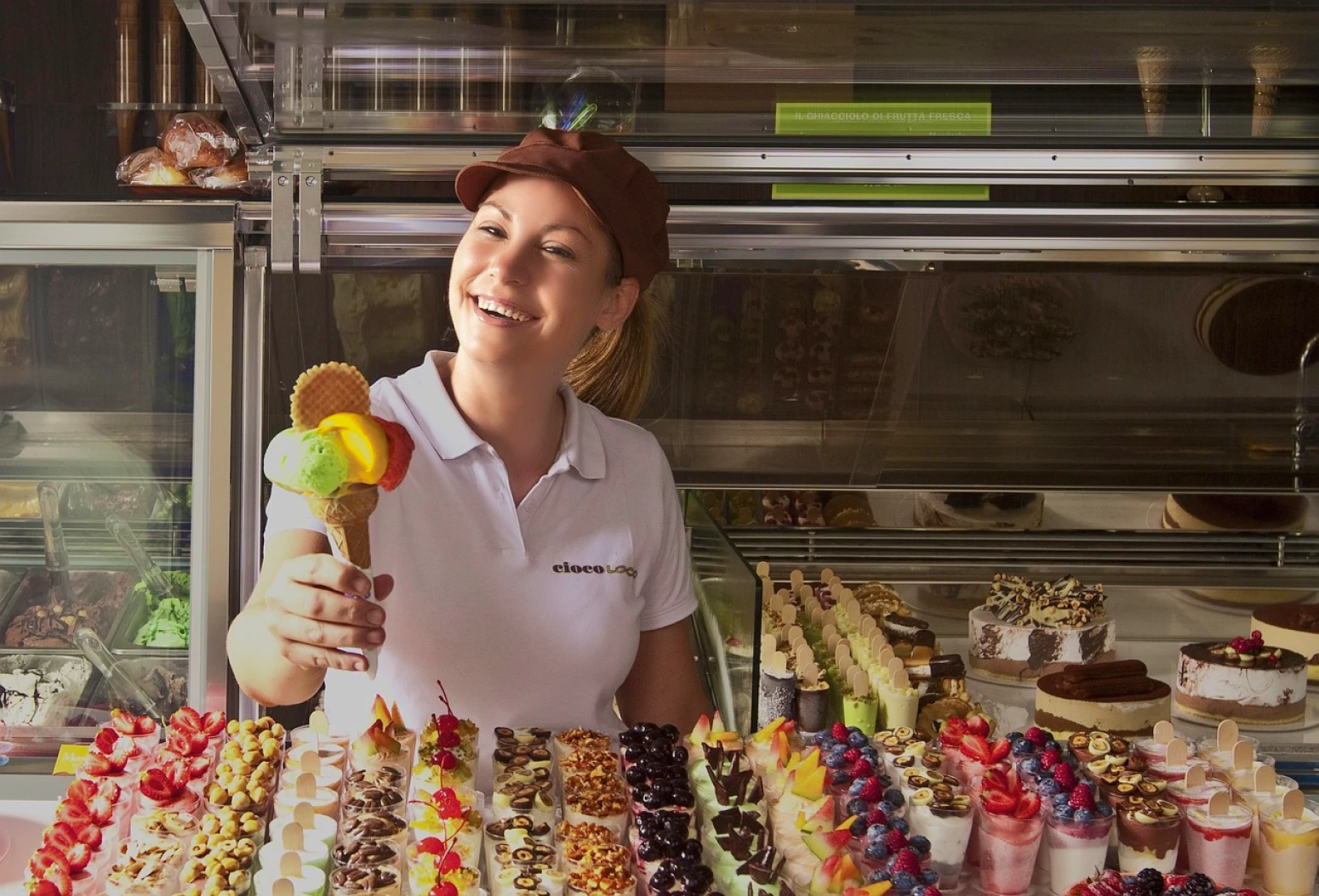 Girl working at a ice cream shop to fund her gap year in Italy