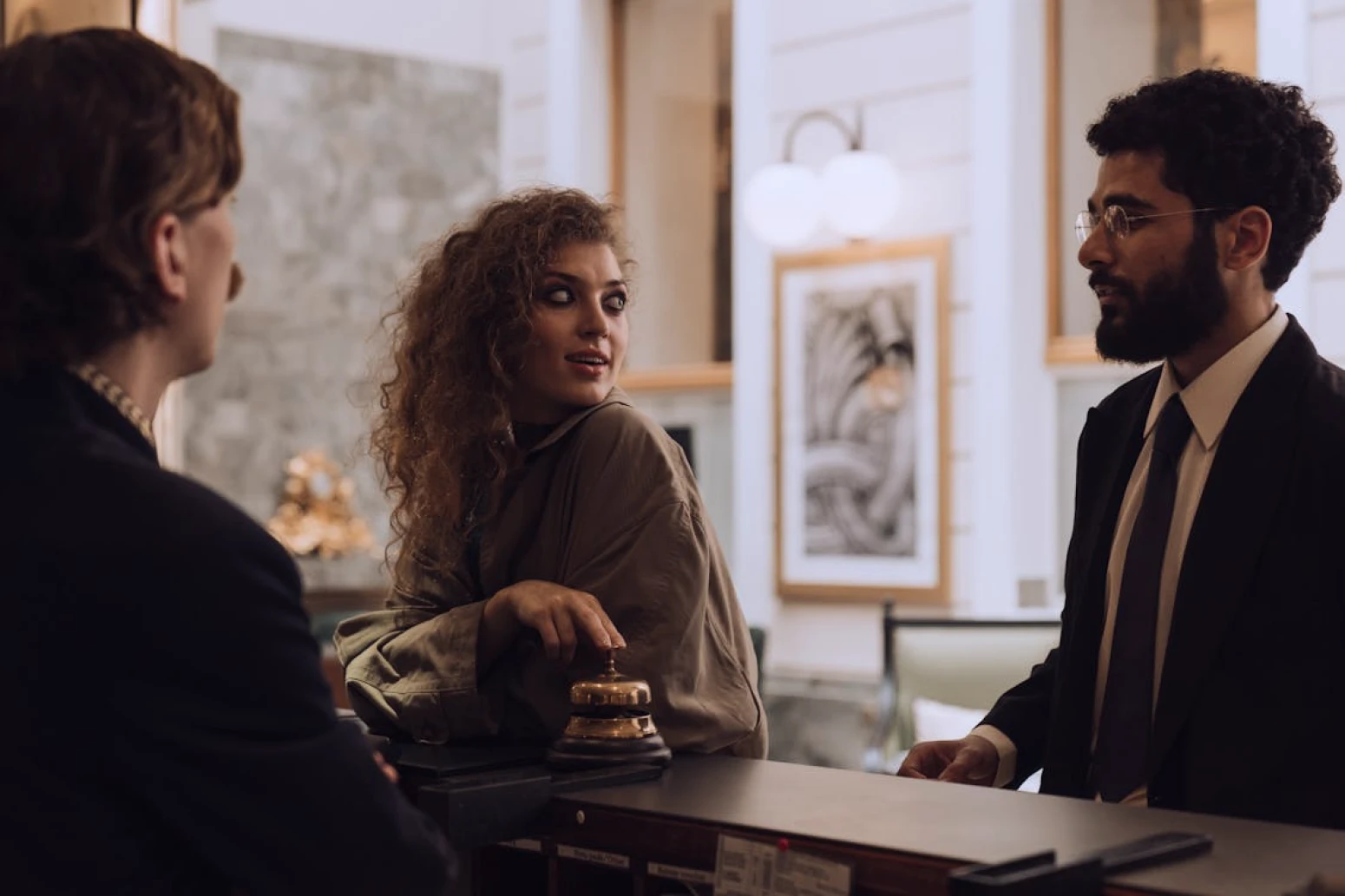 Guests talking to a hotel concierge