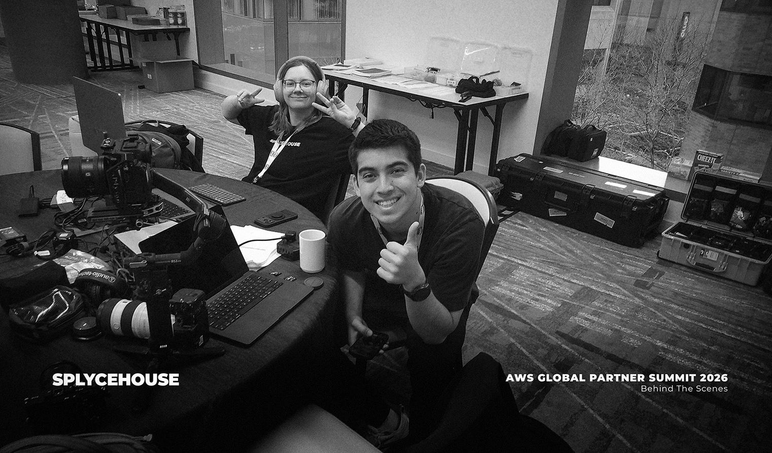 Behind-the-scenes photo of a video production team at the Amazon Web Services Global Partner Summit in Seattle, capturing crew members operating cameras, and coordinating on-site event coverage.