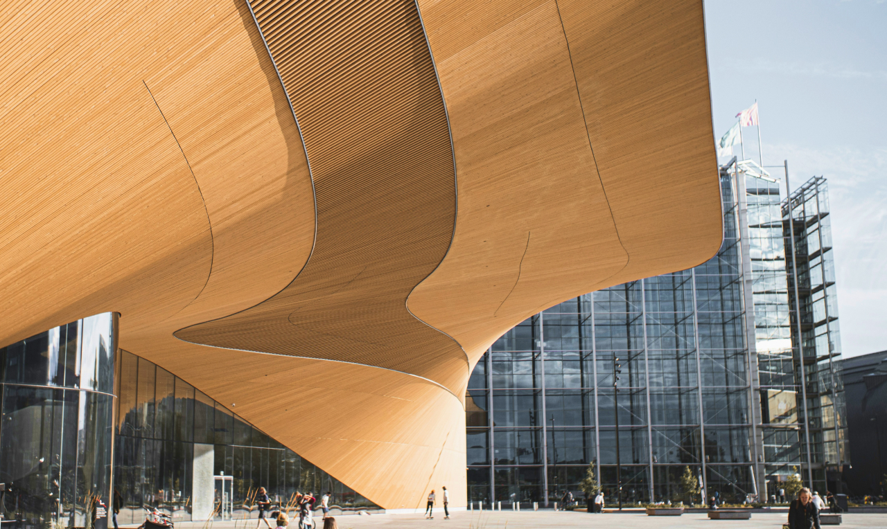 Office space with 2 people working on their computers and facing back