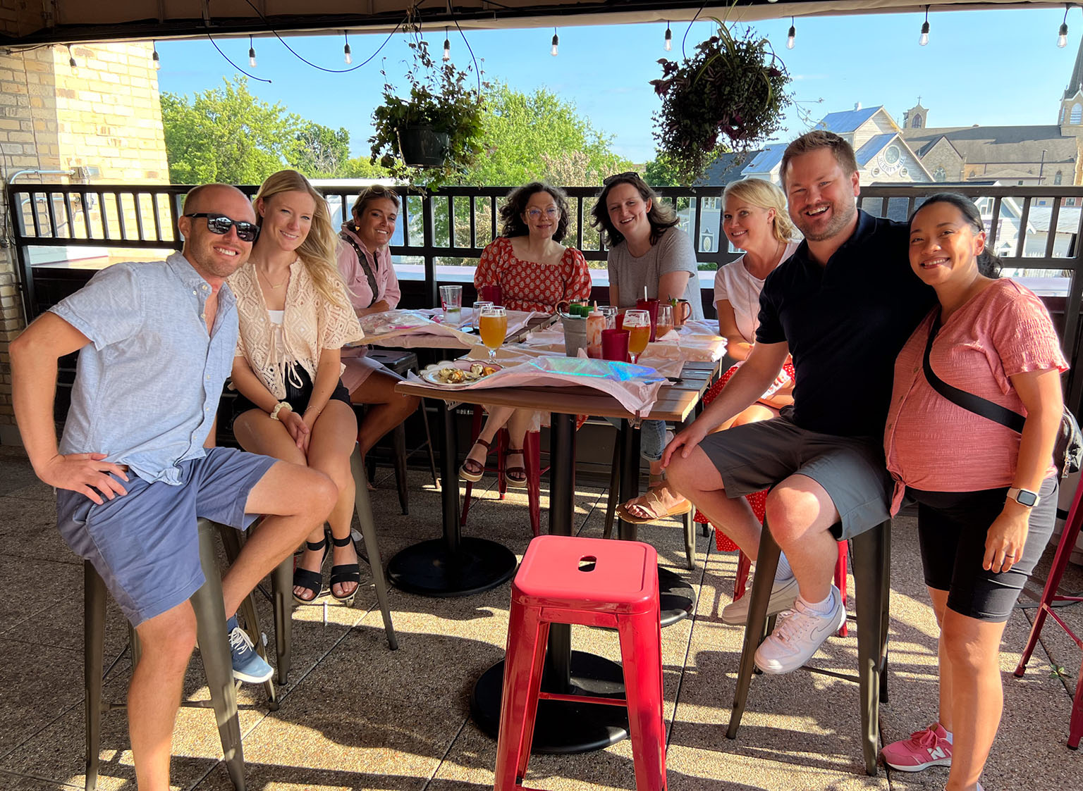The US team sitting around a table at the late summer team activity.