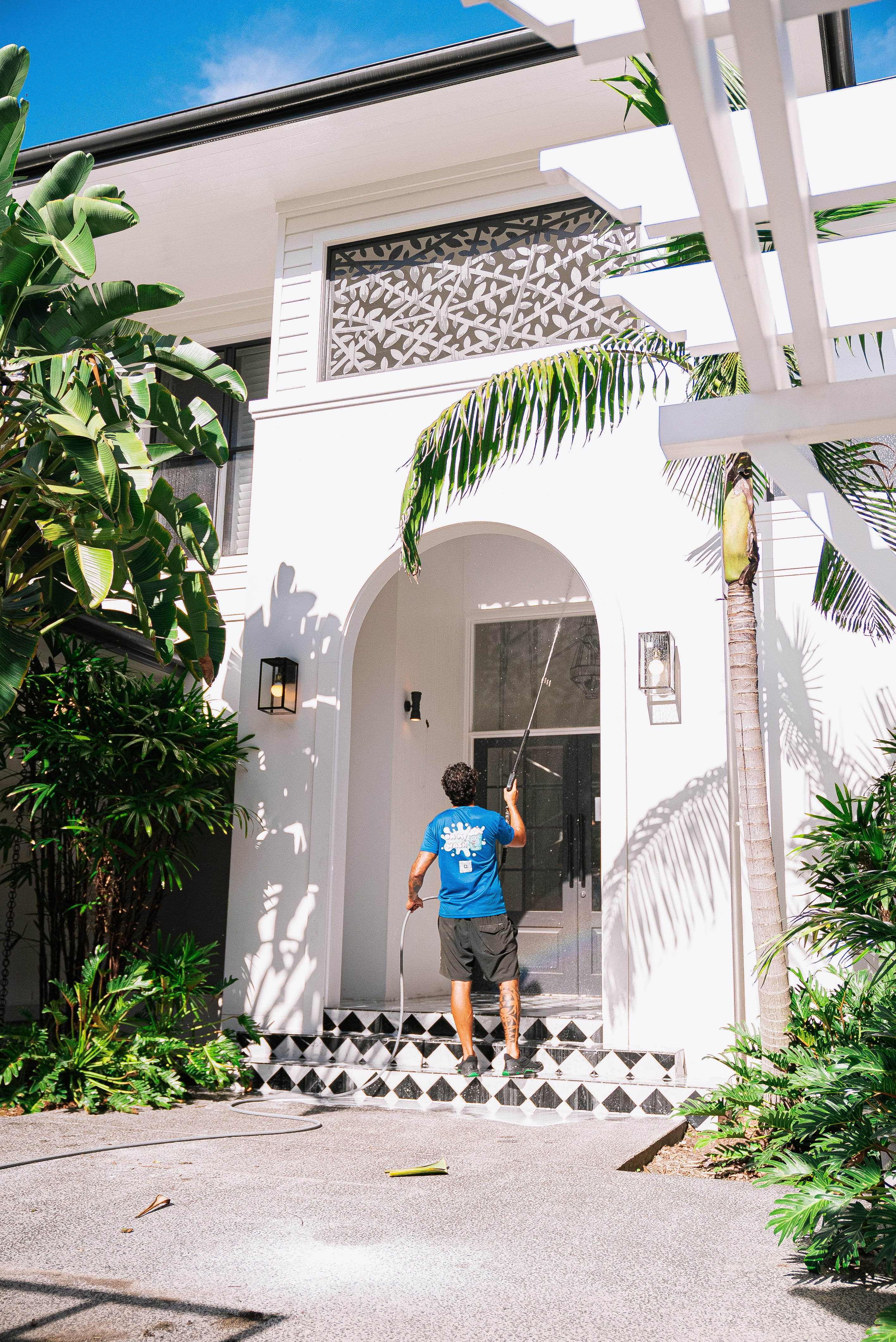 Pressure washing entrance and walkway of commercial property Gold Coast