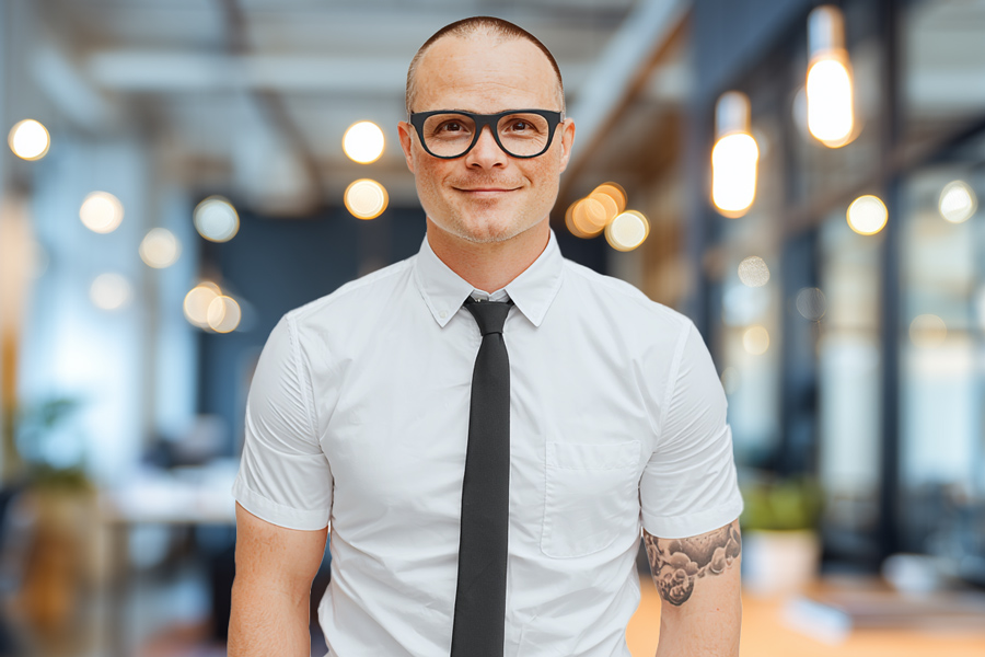 Avatar of Dave Epperly wearing a white shirt and tie, standing in an office.