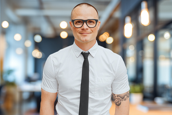 Avatar of Dave Epperly wearing a white shirt and tie, standing in an office.